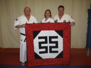 Double Axe banner - Phillip Koeppel, Heather Wall and Mike Wall